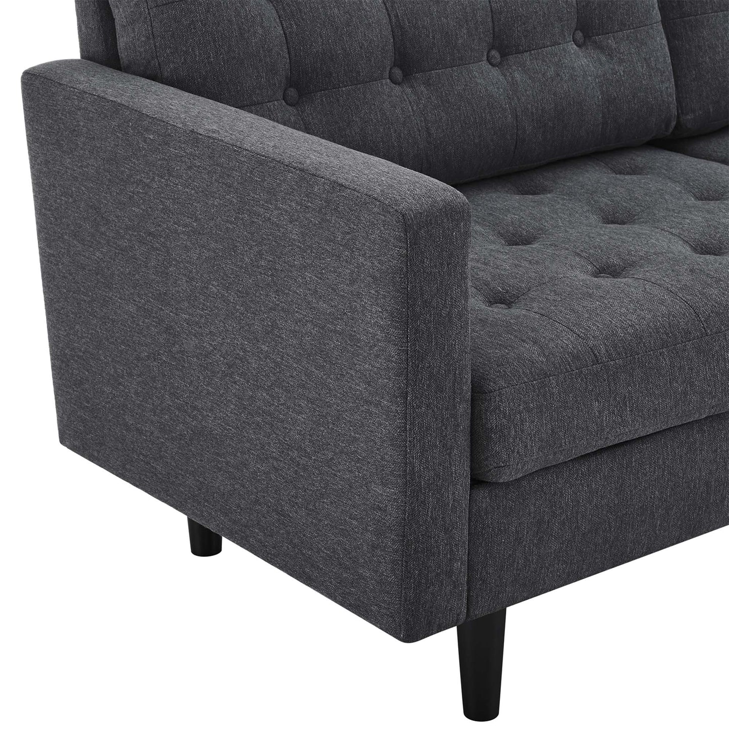 Dark gray upholstered sofa with tufted back and seat cushions, square arms, and tapered black legs.