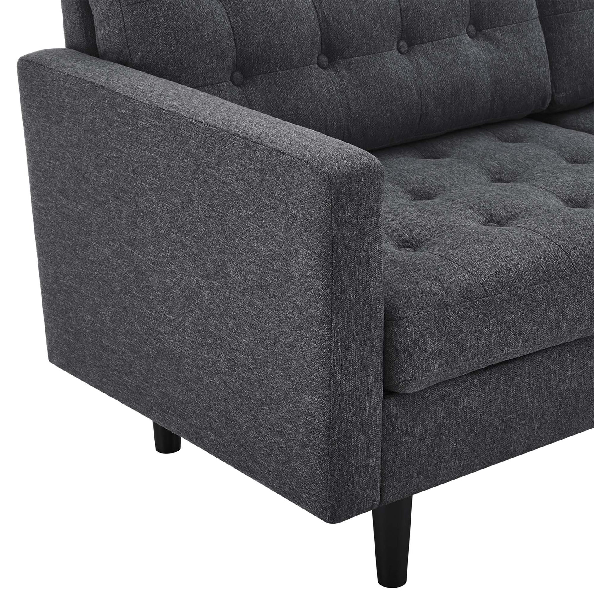 Dark gray upholstered sofa with tufted back and seat cushions, square arms, and tapered black legs.