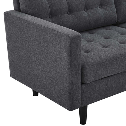 Dark gray upholstered sofa with tufted back and seat cushions, square arms, and tapered black legs.