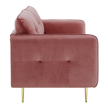 Dusty-rose velvet sofa with tufted back cushions and gold tapered legs; mid-century modern style.