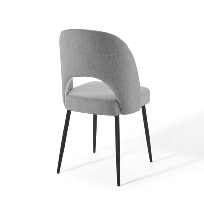 Light gray fabric dining chair with curved wraparound back and black tapered legs