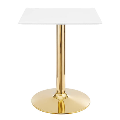 White square dining table on a gold brass pedestal with a round gold base; modern, sleek dining table.