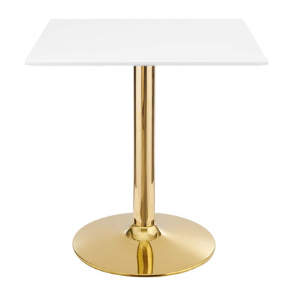 White square tabletop on a polished gold pedestal with a round gold base.