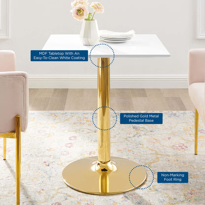 Modern square white MDF tabletop with easy-clean coating on a polished gold pedestal base and non-marking foot ring.