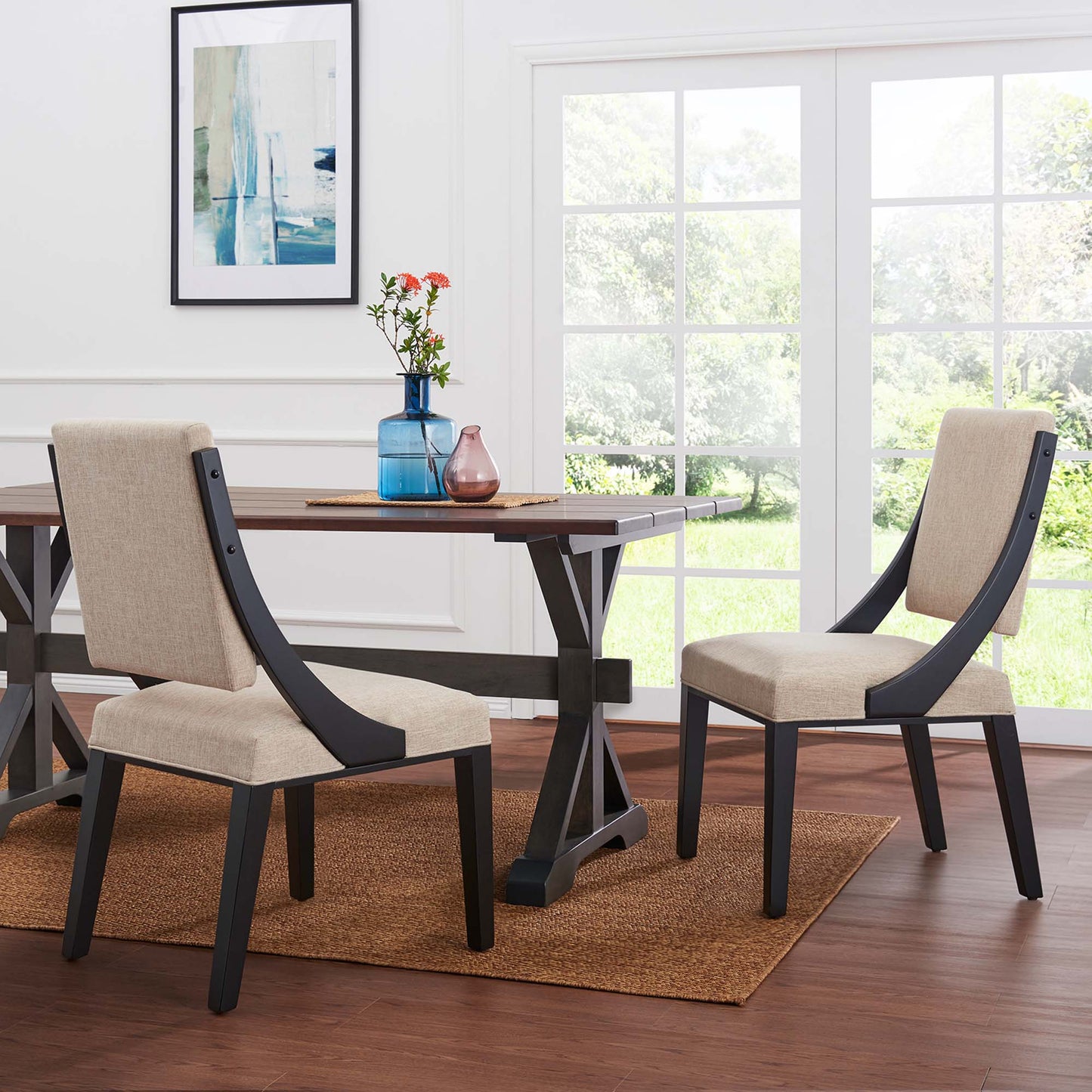 Beige upholstered fabric dining chairs with dark charcoal frames (set of 2).