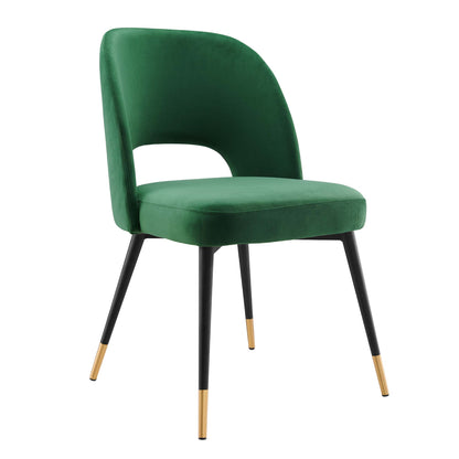 Emerald green velvet dining side chairs, set of 2, with curved backs, cushioned seats, black legs with gold-tipped feet.