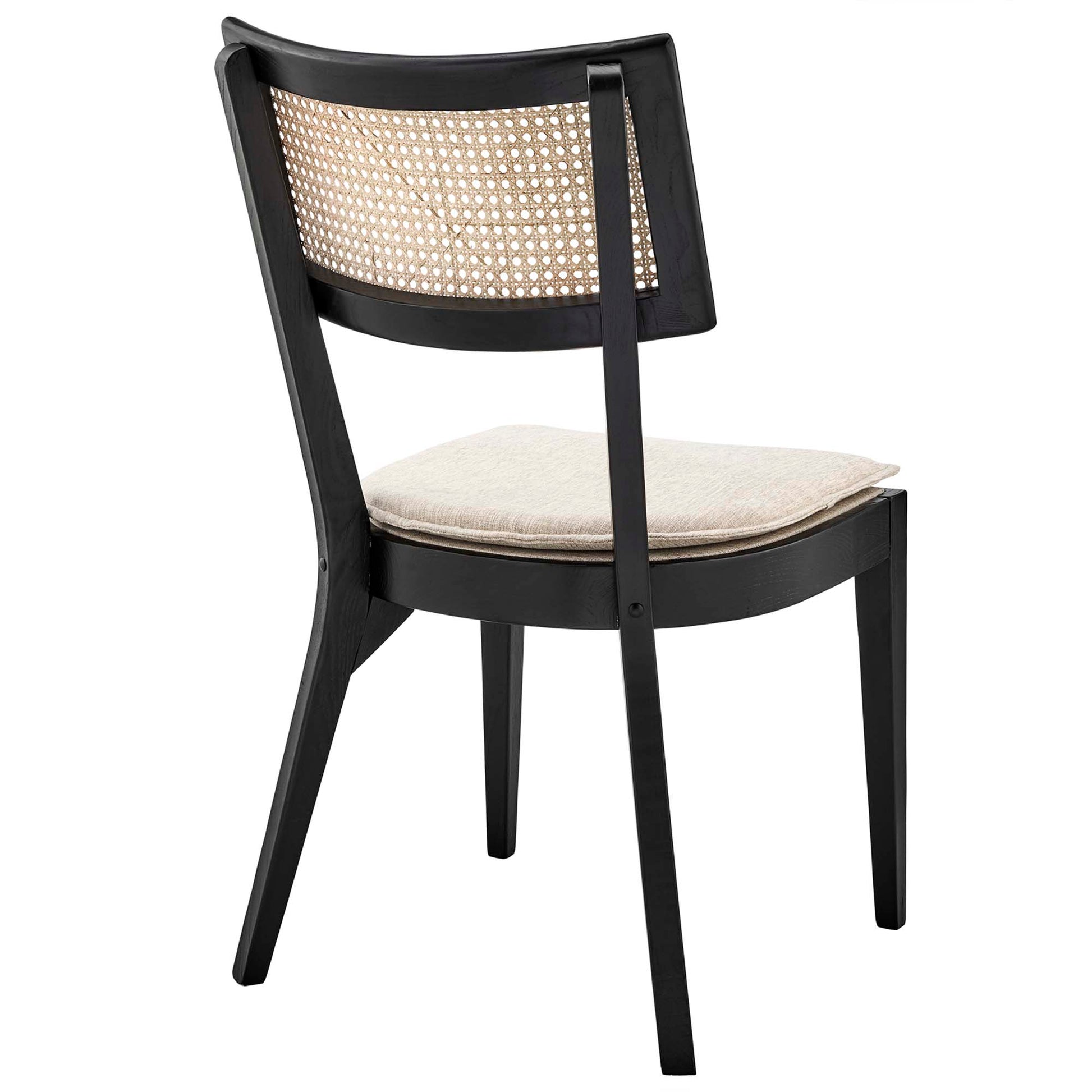 Black wooden dining chair with woven cane back and beige cushioned seat.