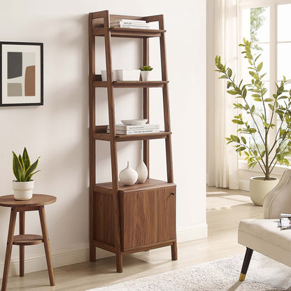 Walnut wood ladder bookshelf with open shelves and a cabinet base, styled with vases and books in a bright living room.