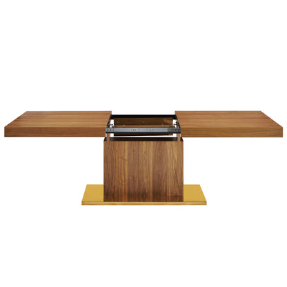 Walnut veneer extendable dining table with two side leaves, central pedestal base, gold-tone plinth.