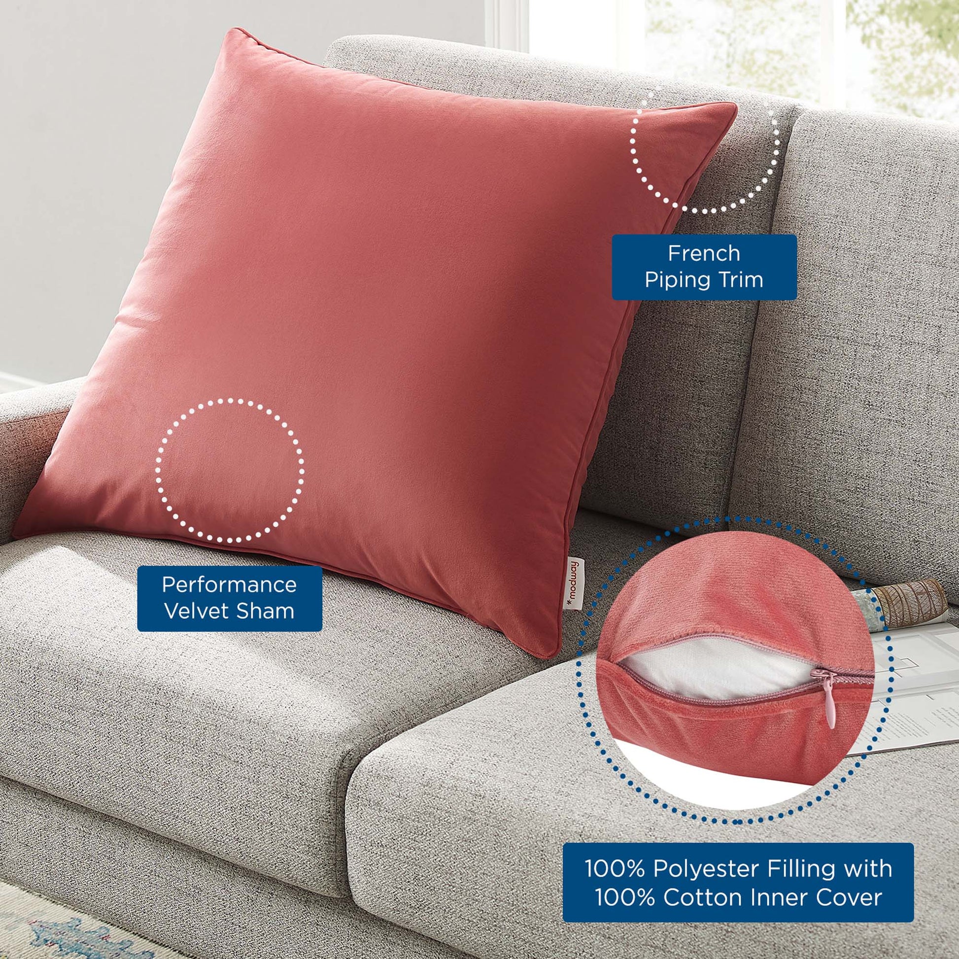 Coral pink square performance velvet throw pillow with French piping trim on a light gray sofa; decorative cushion.