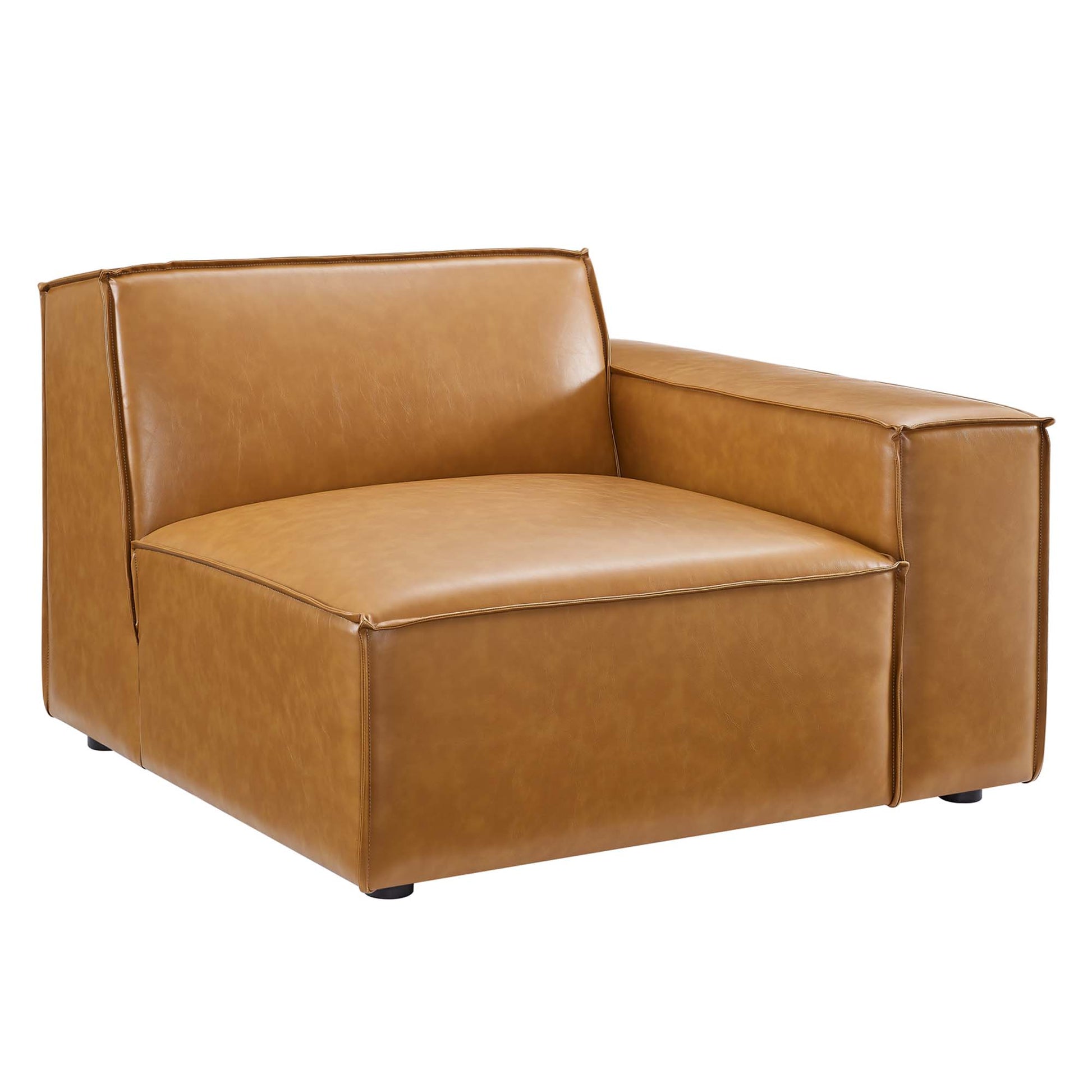 Tan vegan leather sectional sofa with a boxy silhouette, wide arms, cushioned seat and back, and short legs.