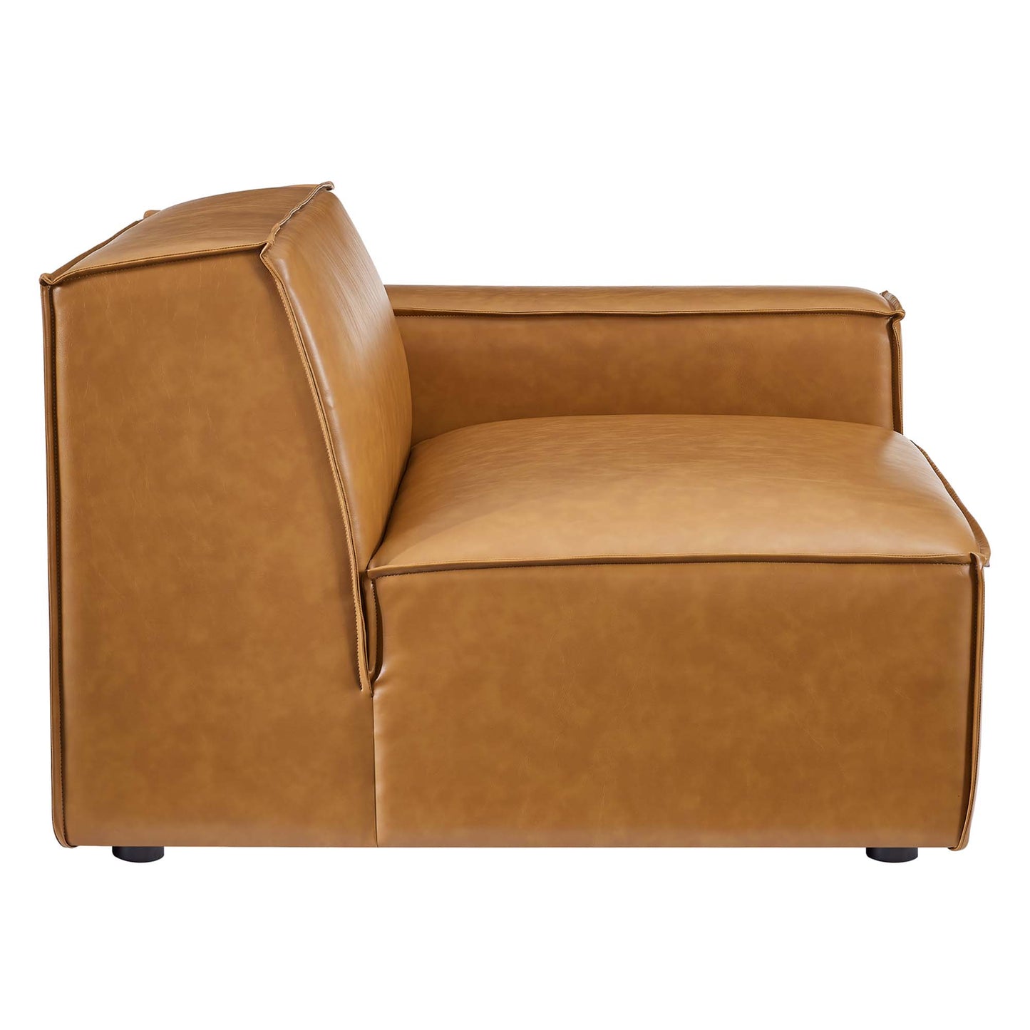 Tan vegan leather sectional sofa with a boxy silhouette, thick cushions, straight back and arms, visible stitching, and low feet.