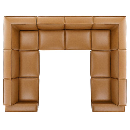 Tan vegan leather sectional sofa with padded cushions along all sides, forming a large U-shaped seating.