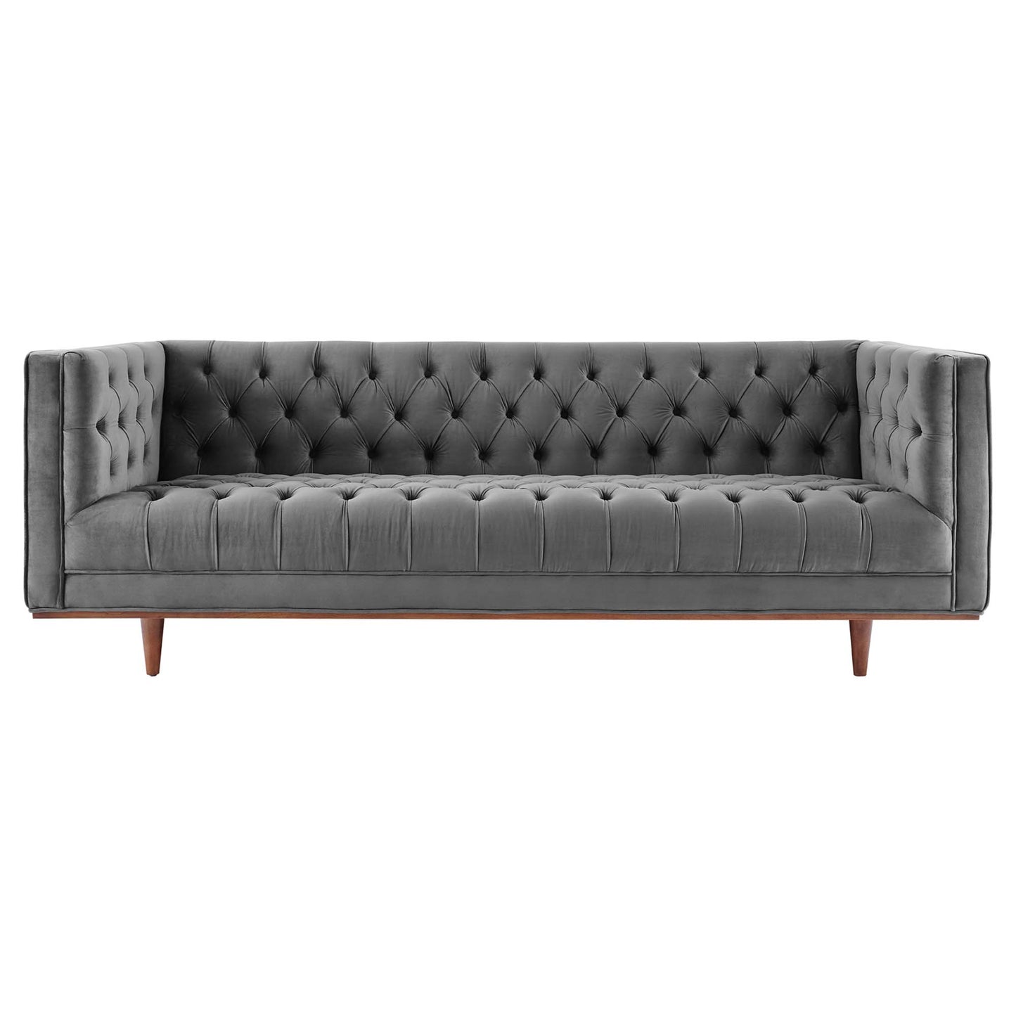 Grey velvet tufted sofa with button-tufted back, slim arms, and wooden tapered legs in mid-century style.