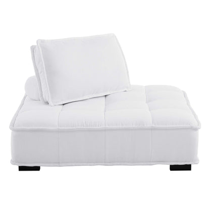 White tufted fabric armless chair with back cushion and cylindrical bolster, plush contemporary lounge with black feet.