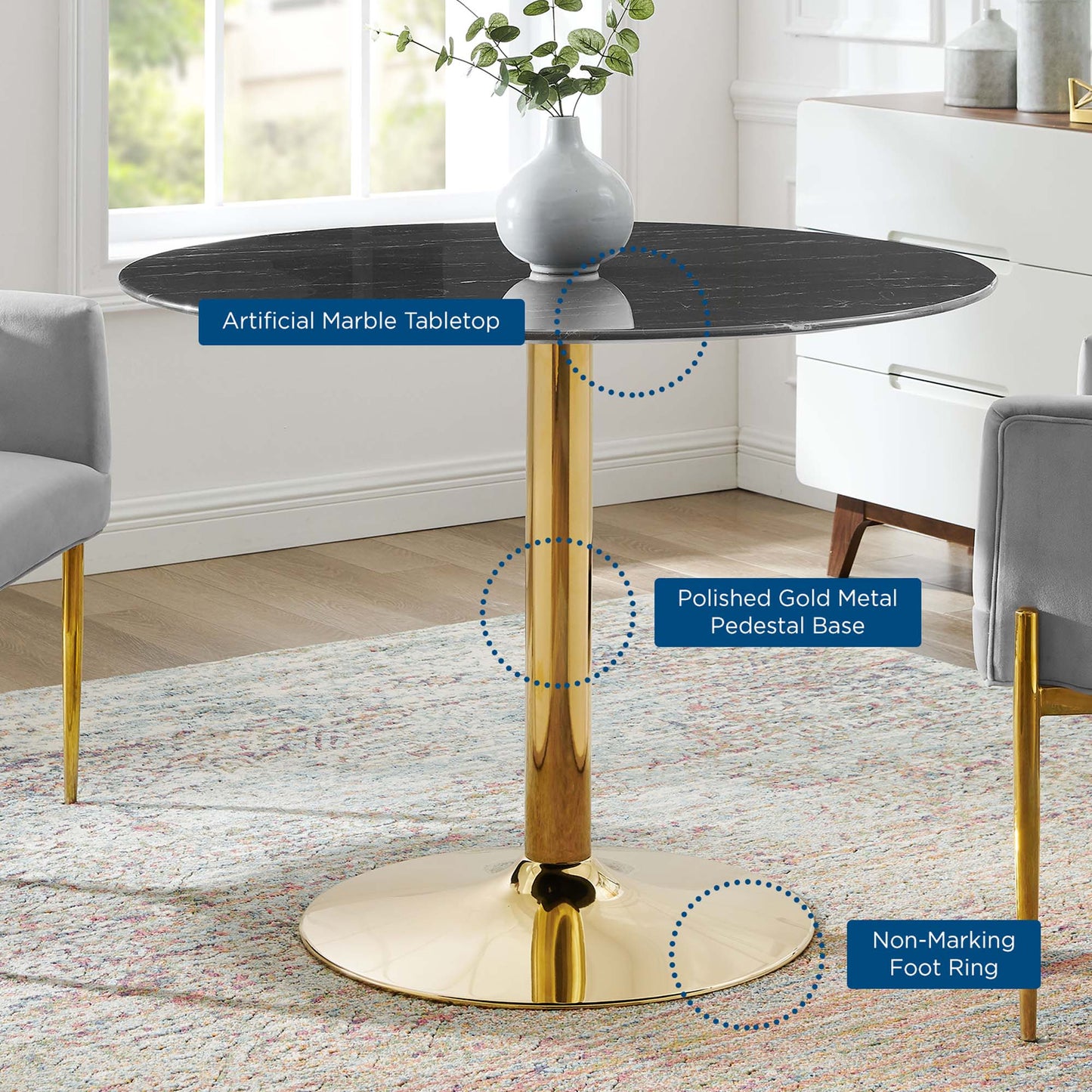 Round black artificial marble tabletop atop a polished gold pedestal base with non-marking foot ring.