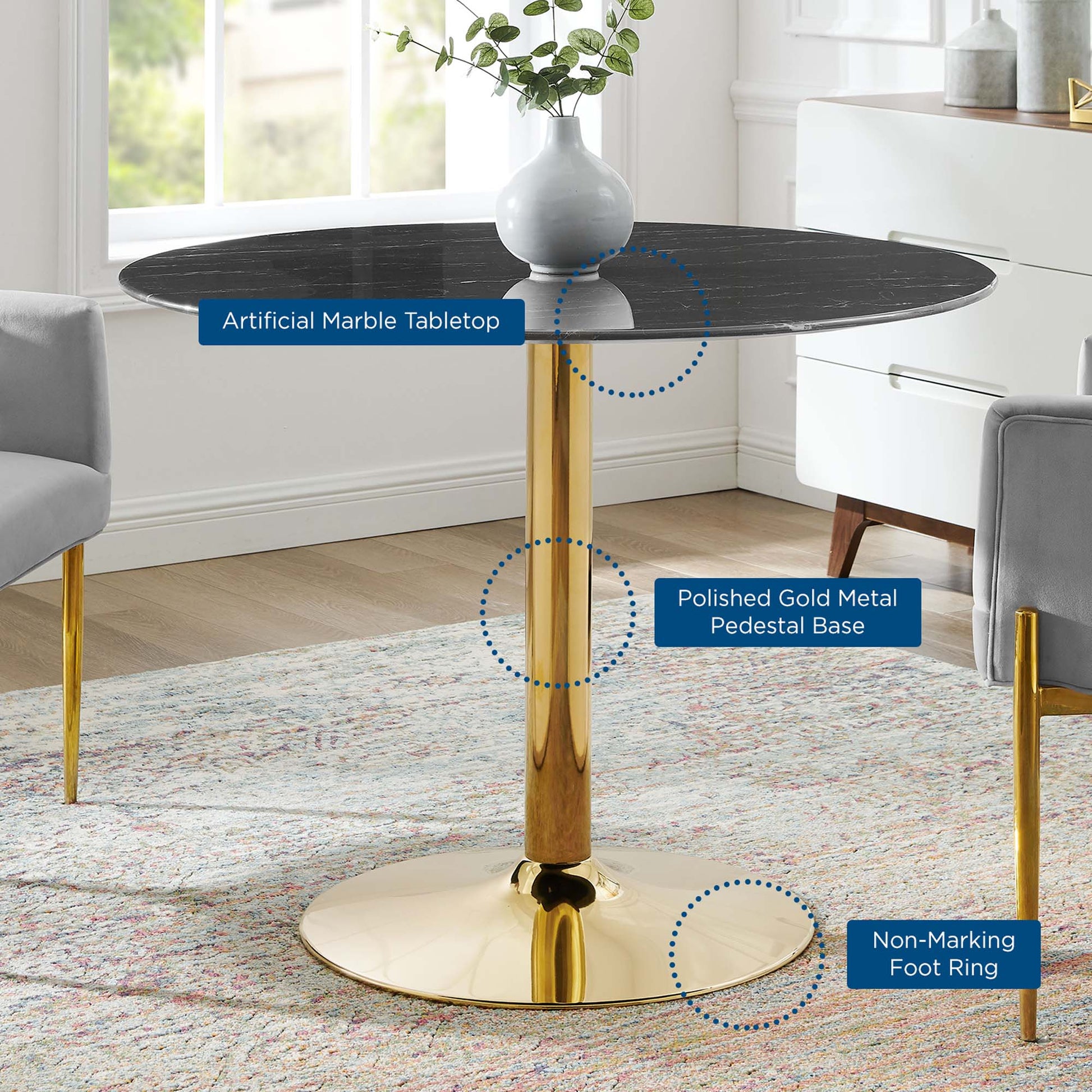 Round black artificial marble tabletop atop a polished gold pedestal base with non-marking foot ring.