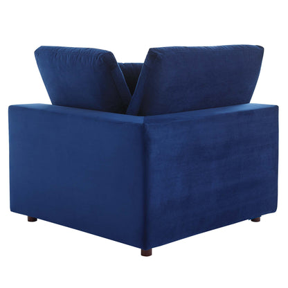 Navy blue velvet square-arm loveseat with two back cushions and short wooden feet.