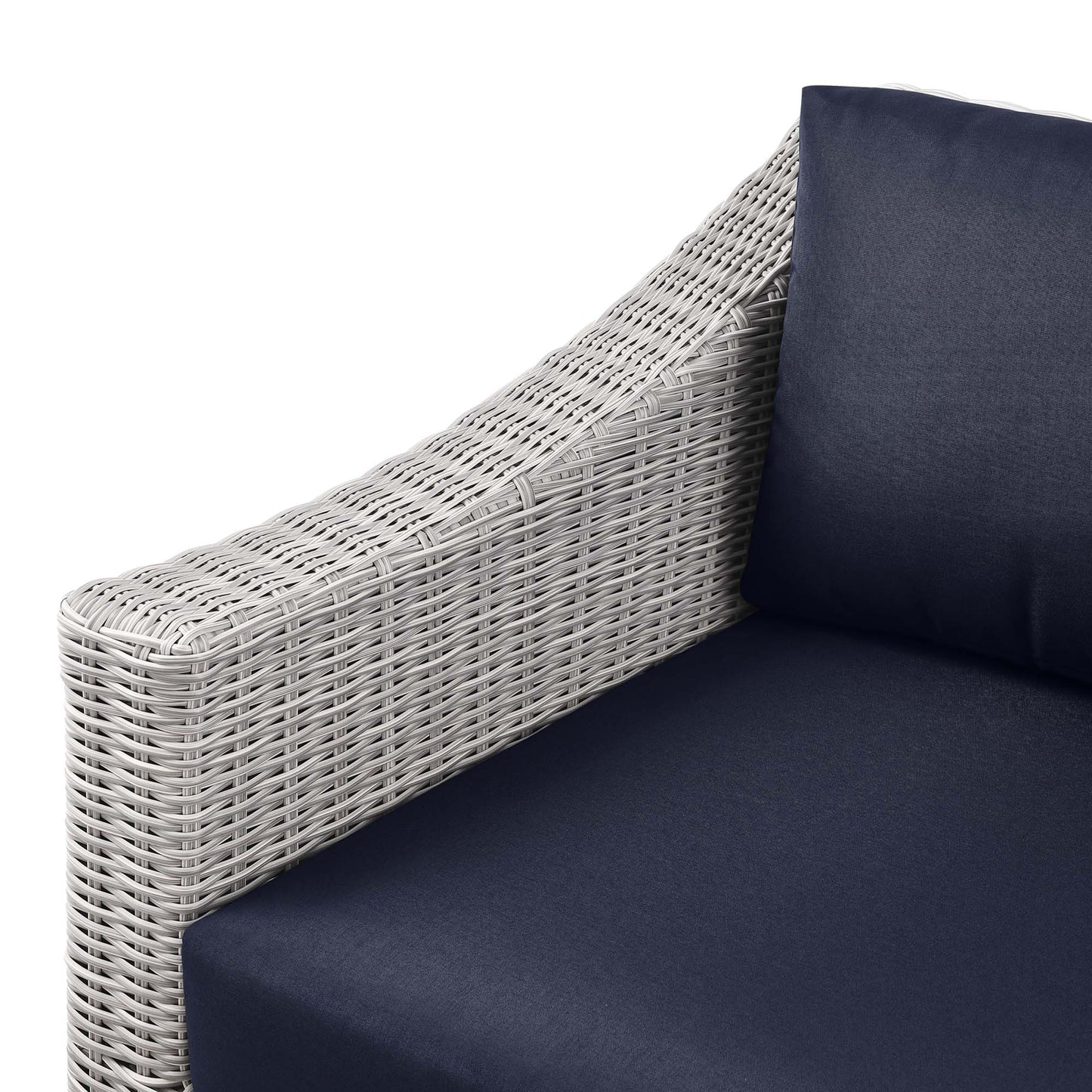Light gray wicker outdoor left-arm chair with navy cushions