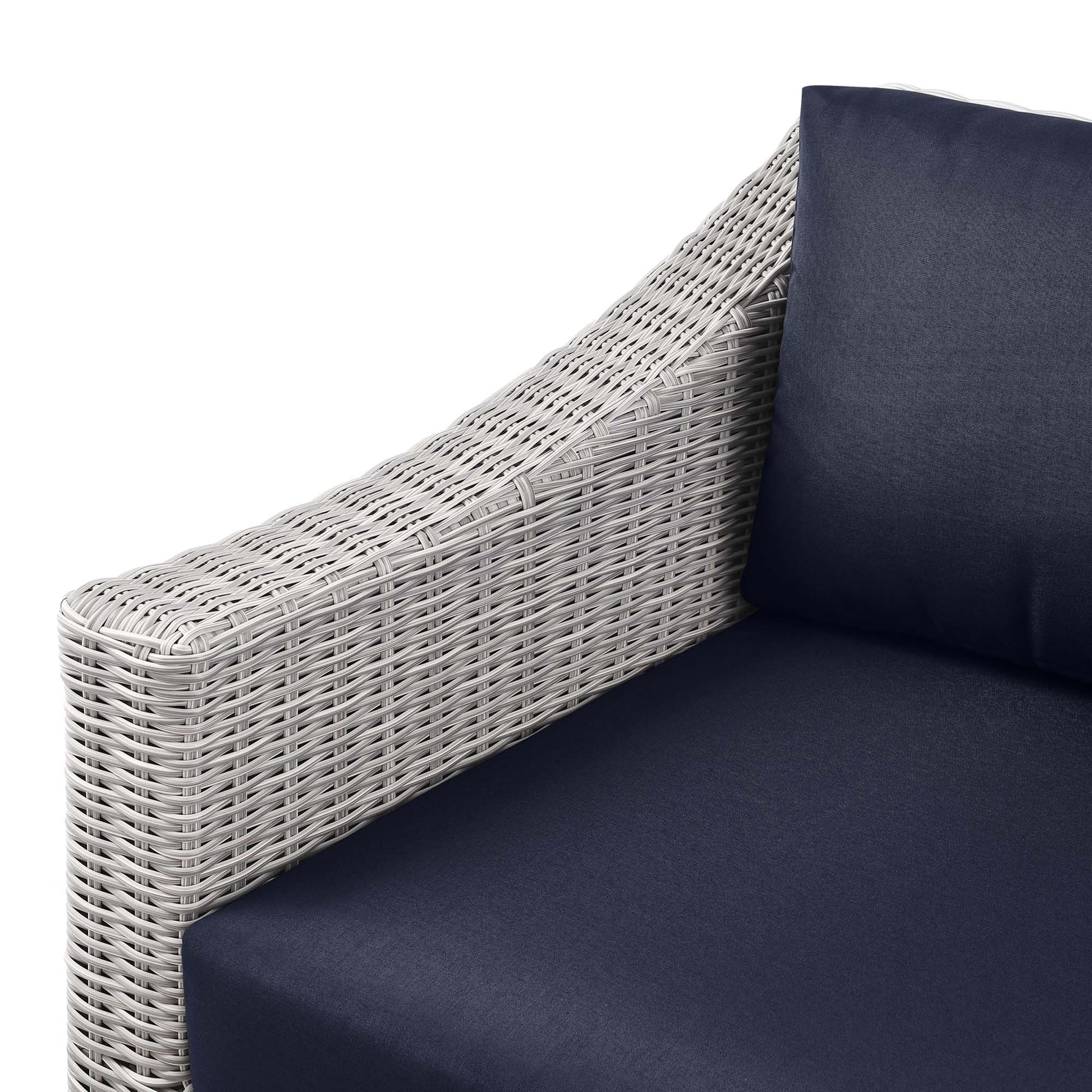 Light gray wicker outdoor left-arm chair with navy cushions
