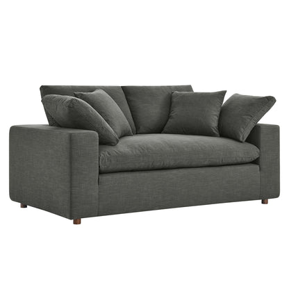 Charcoal grey fabric loveseat with boxy arms and plush back cushions for modern living room seating.