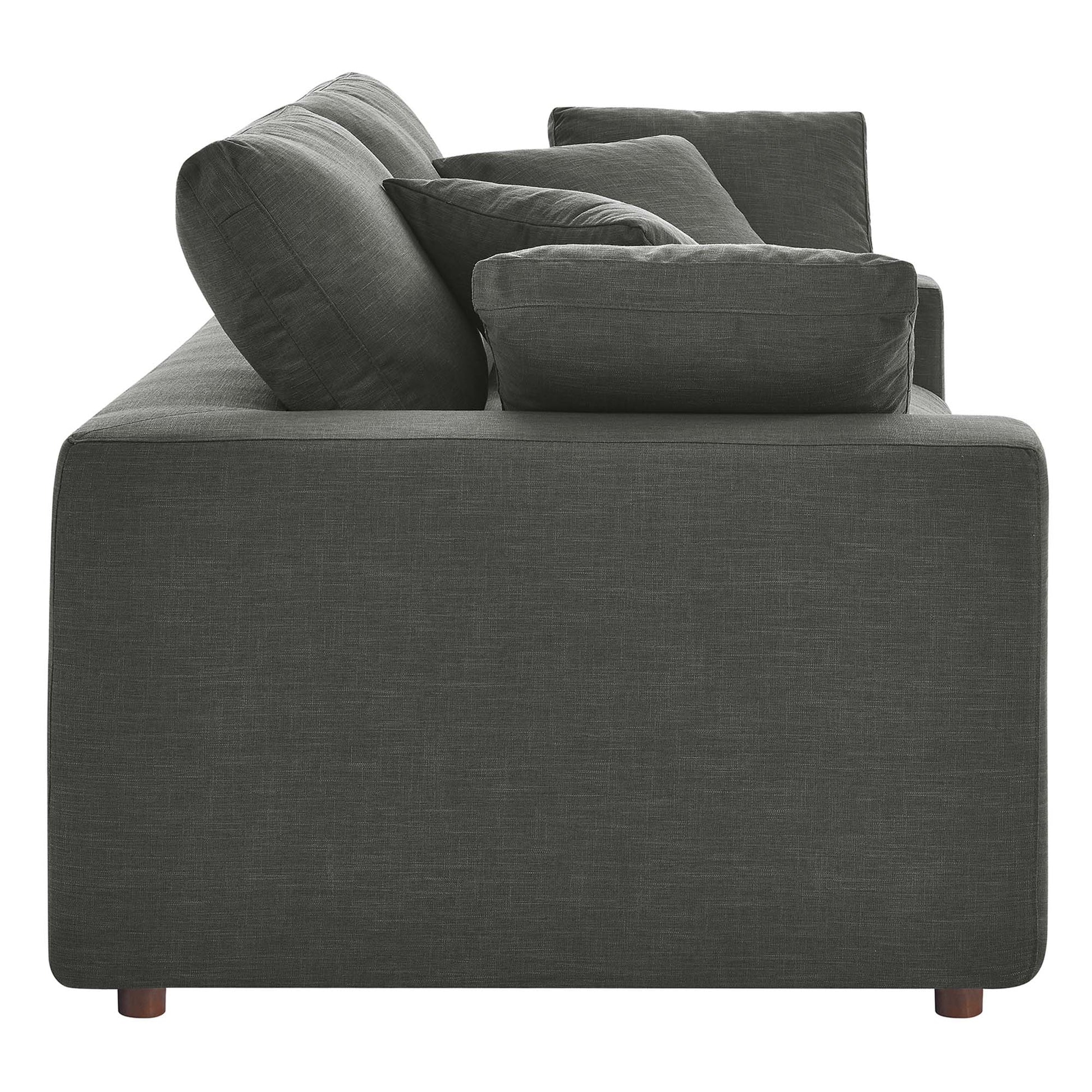 Gray textured fabric loveseat with chunky cushions, boxy arms, and short wooden legs.
