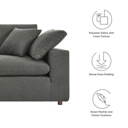 Dark gray overstuffed loveseat with linen-textured polyester fabric, dense foam padding, and down-filled cushions.