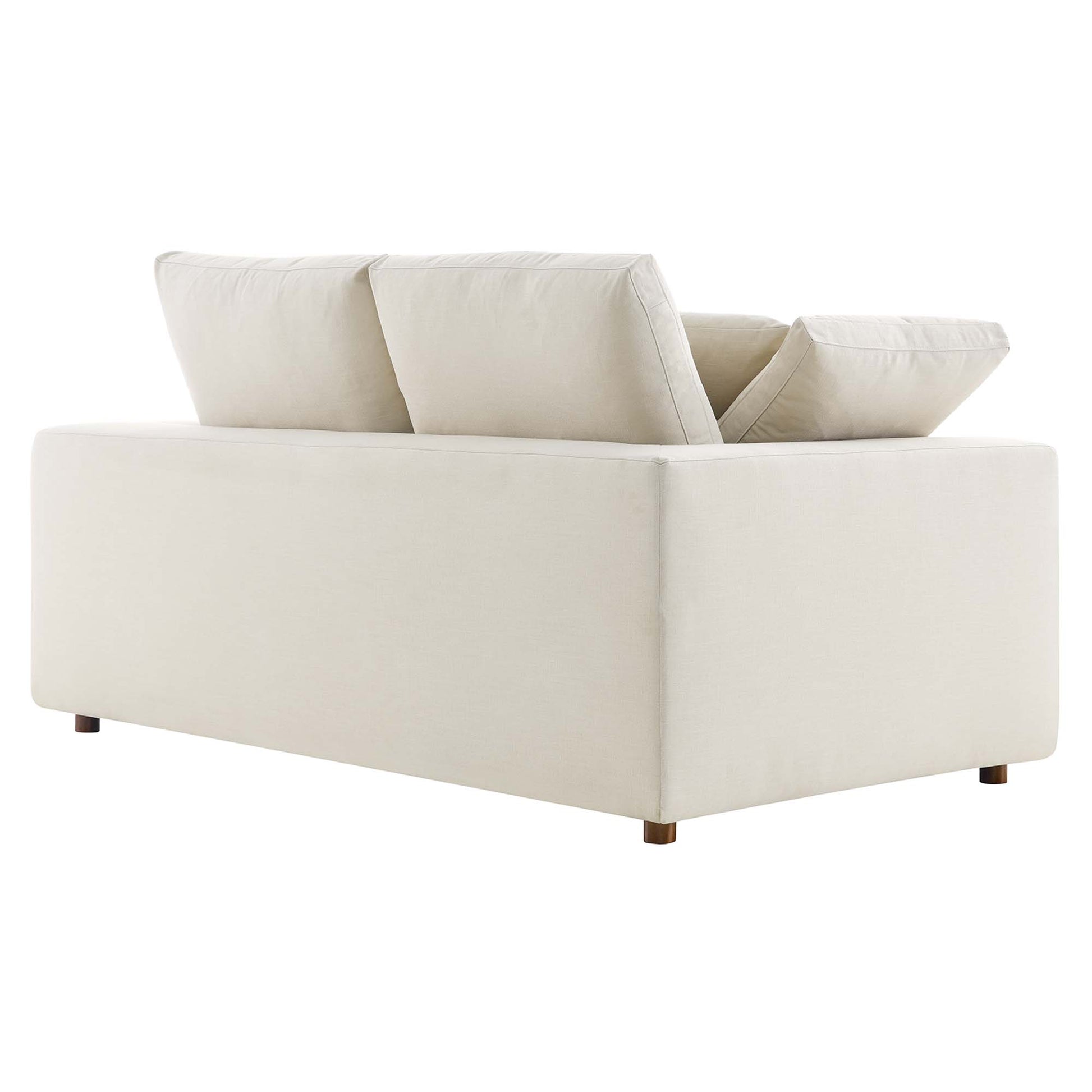 Beige loveseat with square arms and wooden legs; two back cushions and down-filled, overstuffed cushions.