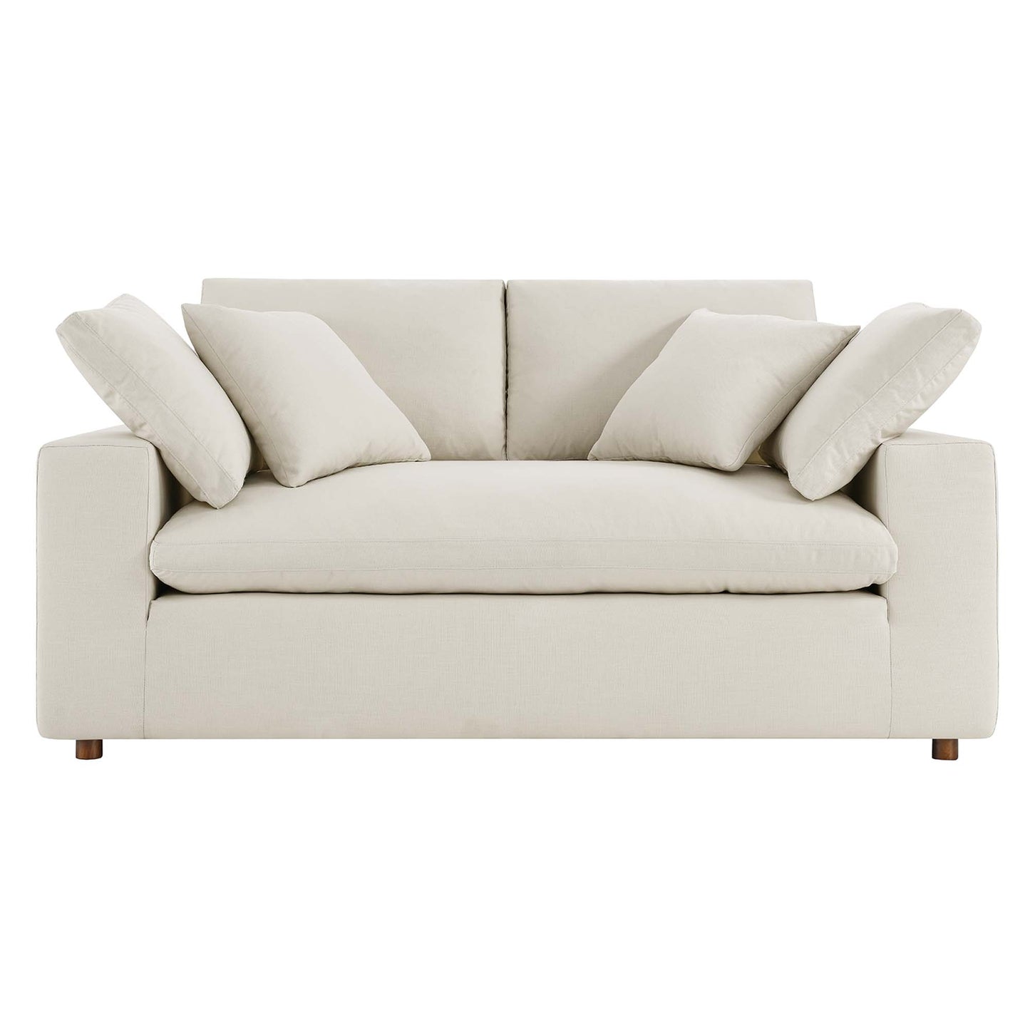 Light beige fabric loveseat with square arms and wooden feet, plush back cushions and coordinating throw pillows.