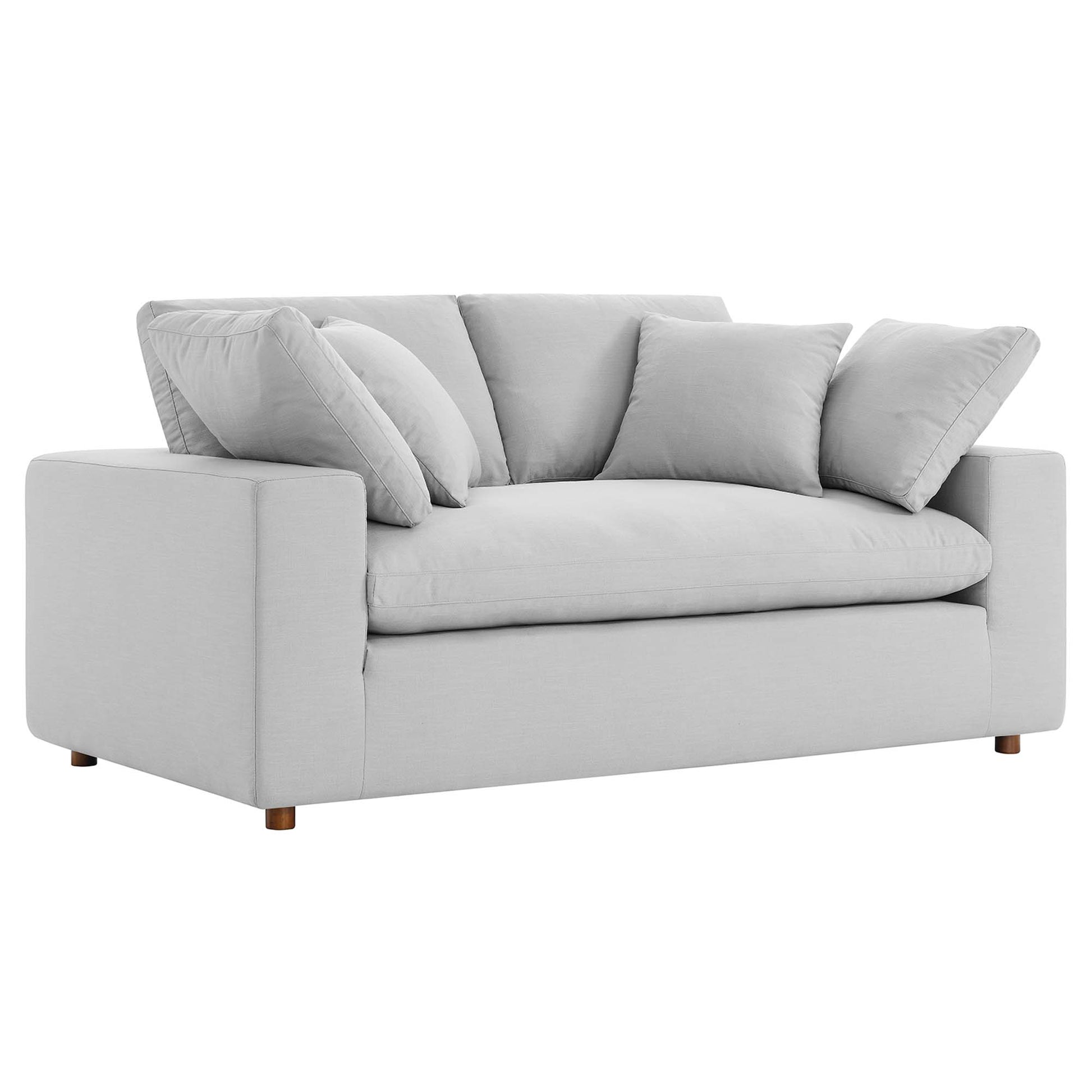Light gray fabric loveseat with wide square arms, three back cushions and two throw pillows, wooden legs.