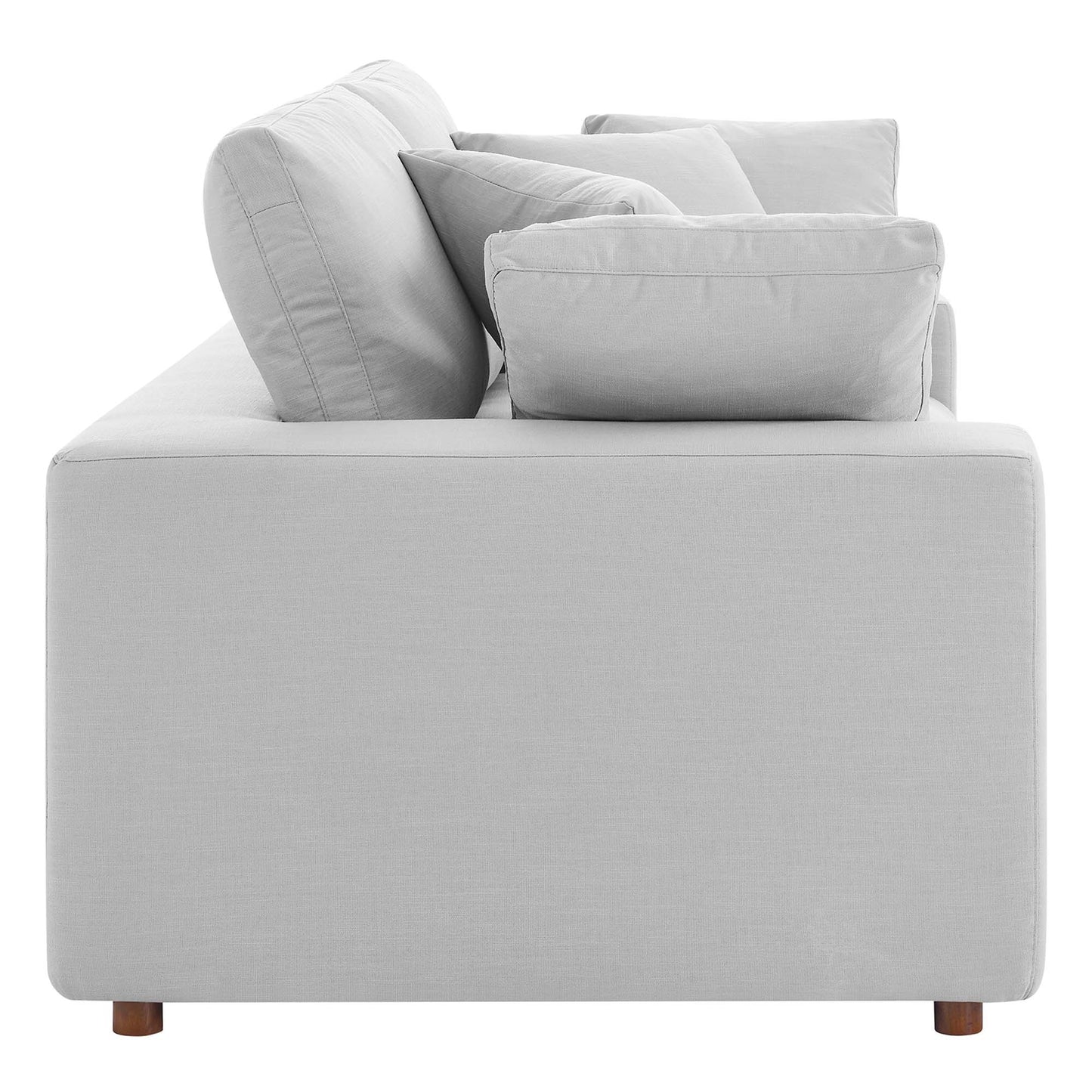 Light gray fabric sofa with square arms, plush cushions, and short wooden legs.