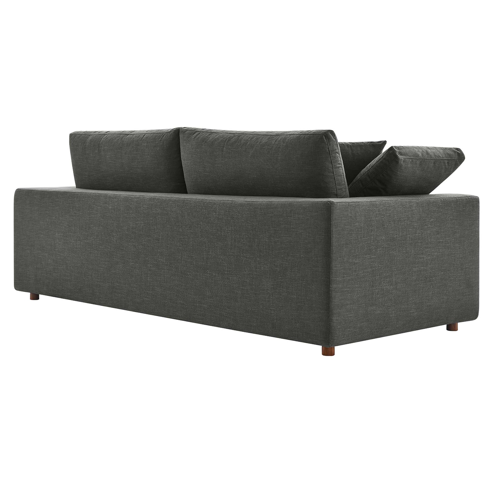 Gray textured fabric sofa with square arms, two back cushions, a loose pillow, and wooden legs.