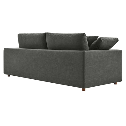 Gray textured fabric sofa with square arms, two back cushions, a loose pillow, and wooden legs.