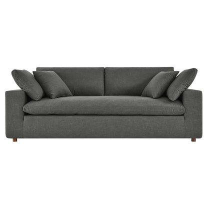 Charcoal gray fabric 3-seat sofa with plush cushions, square arms, six throw pillows and short wooden legs.