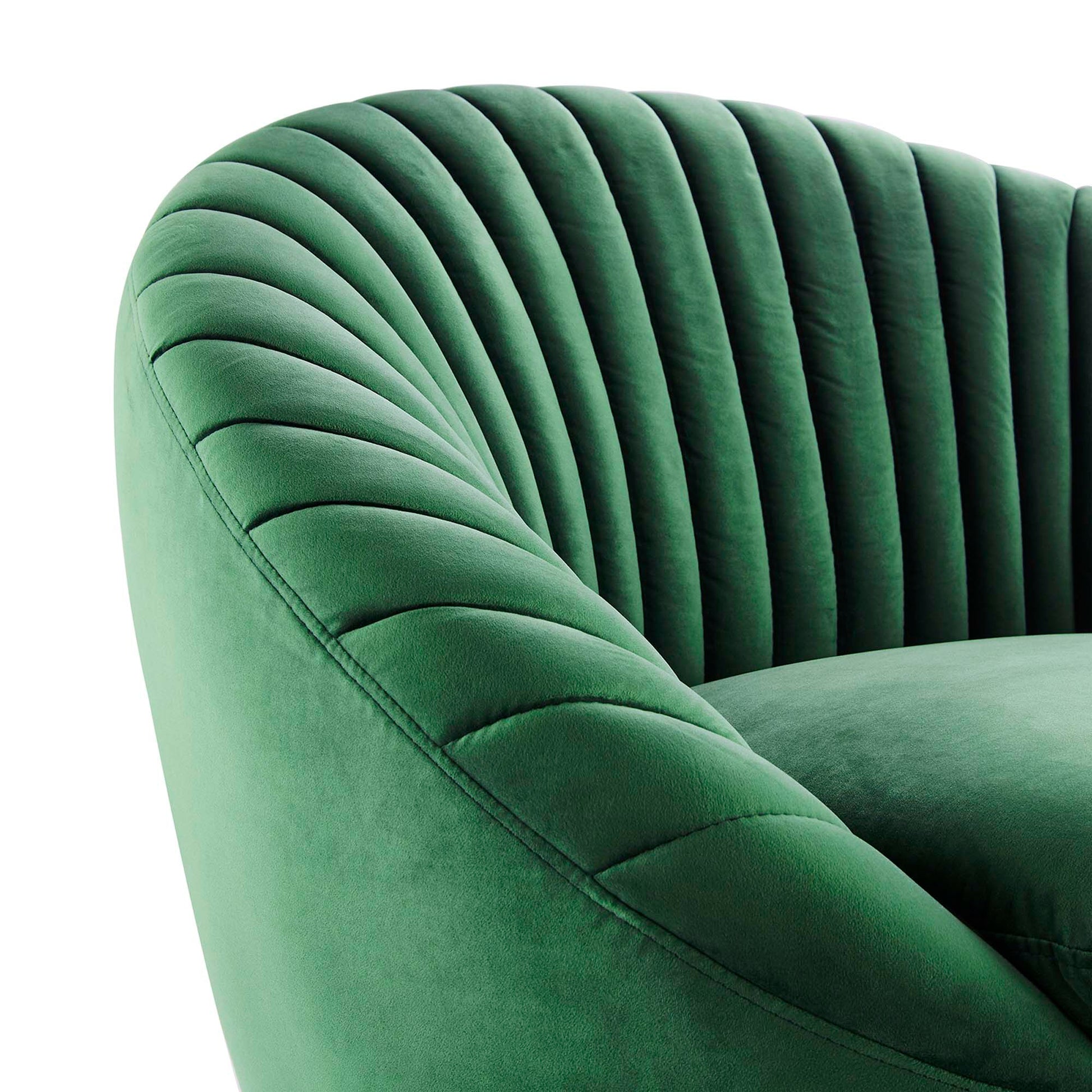 Emerald green velvet swivel chair with curved, channel-tufted back and rounded armrests.