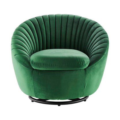 Emerald green velvet round tub chair with tufted back and plush cushion on a black circular metal base