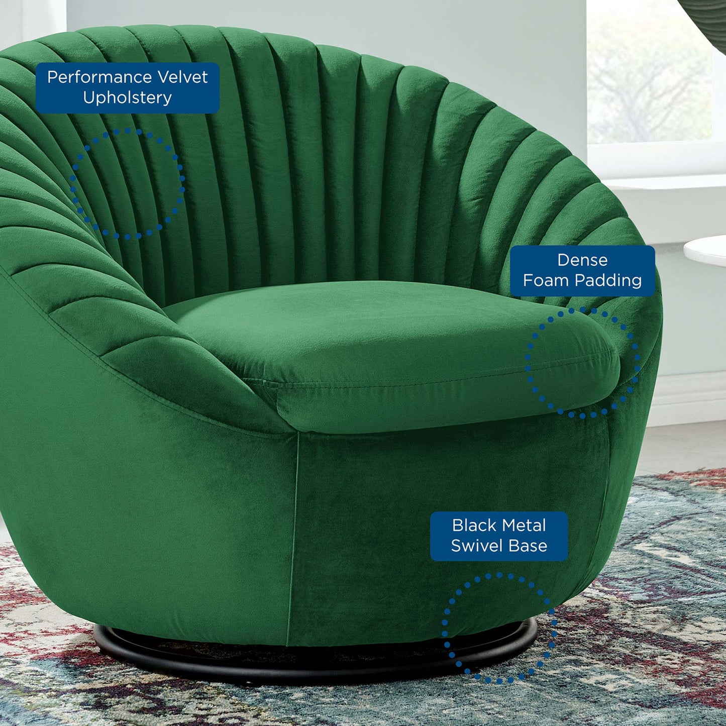 Emerald green tufted velvet swivel chair with rounded back and a black metal swivel base.