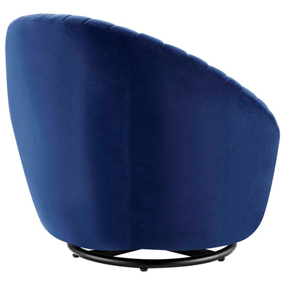 Navy blue velvet curved-back swivel chair on a black circular swivel base.