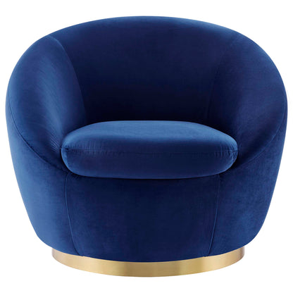 Round navy velvet tub chair with a gold ring base.