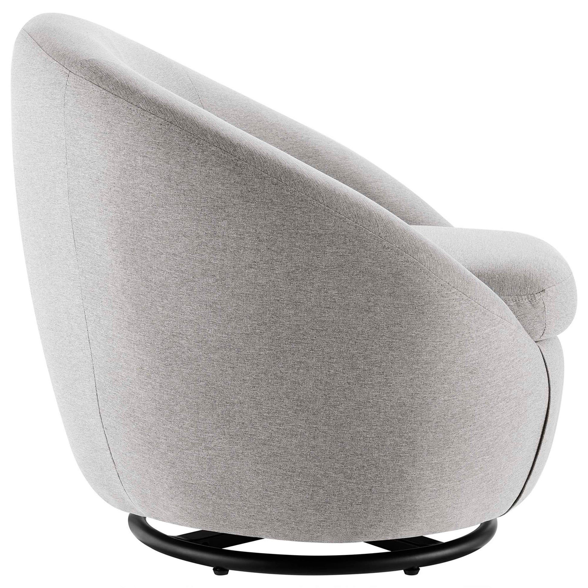 Light gray fabric swivel lounge chair with rounded back and cushioned arms on a black circular base.