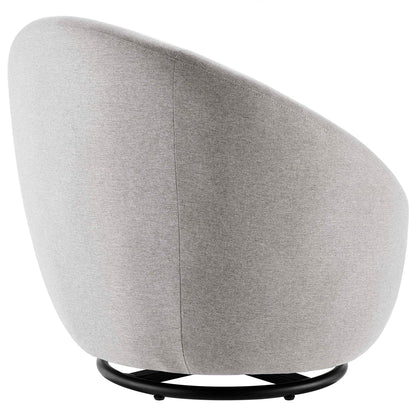 Light gray upholstered swivel chair with a rounded back and shell, supported by a black circular pedestal base.