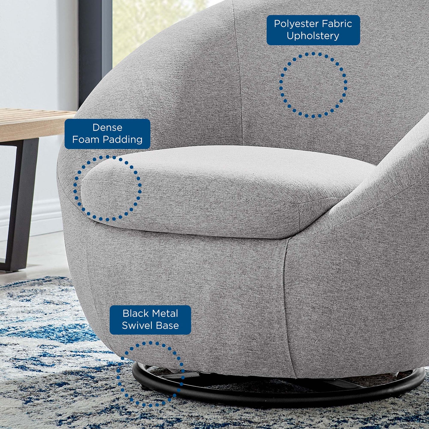 Gray rounded lounge chair with dense foam padding, polyester fabric upholstery & a black metal swivel base.
