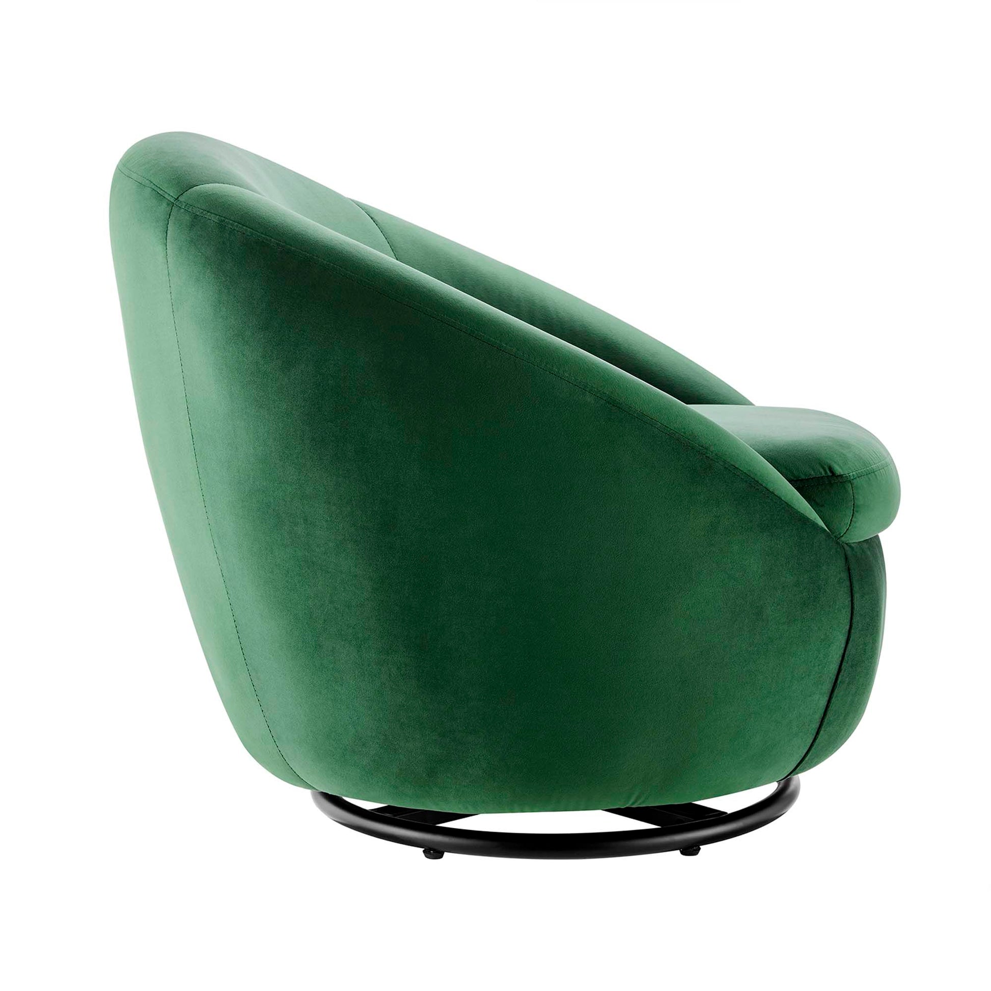 Emerald green velvet swivel lounge chair with rounded back and curved arms on a black circular metal base.