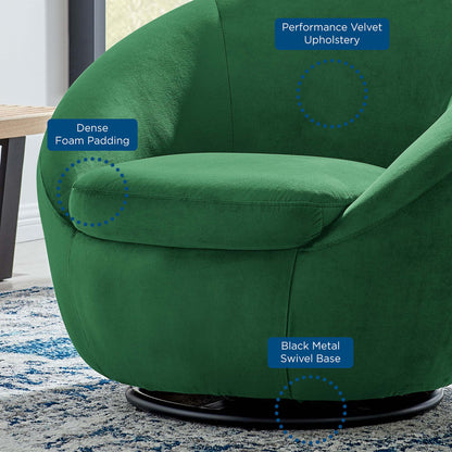 Emerald green performance velvet swivel chair with dense foam padding and black metal swivel base.
