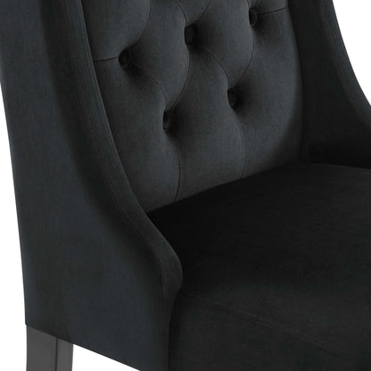 Black velvet tufted dining chairs (set of 2) with curved arms and button-tufted backs.