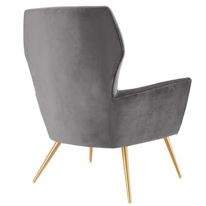 Gray velvet armchair with a tall curved back, button tufting, and angled gold legs in a mid-century modern style.