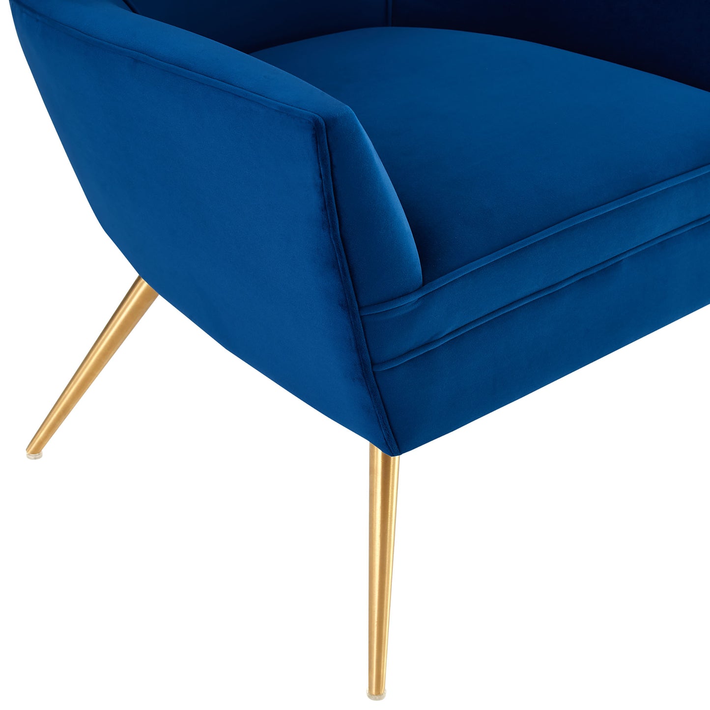 Navy velvet armchair with curved arms and gold tapered legs.