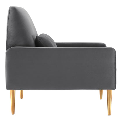 Charcoal gray velvet lounge chair with tall back, gold tapered legs and a matching bolster cushion, side view.