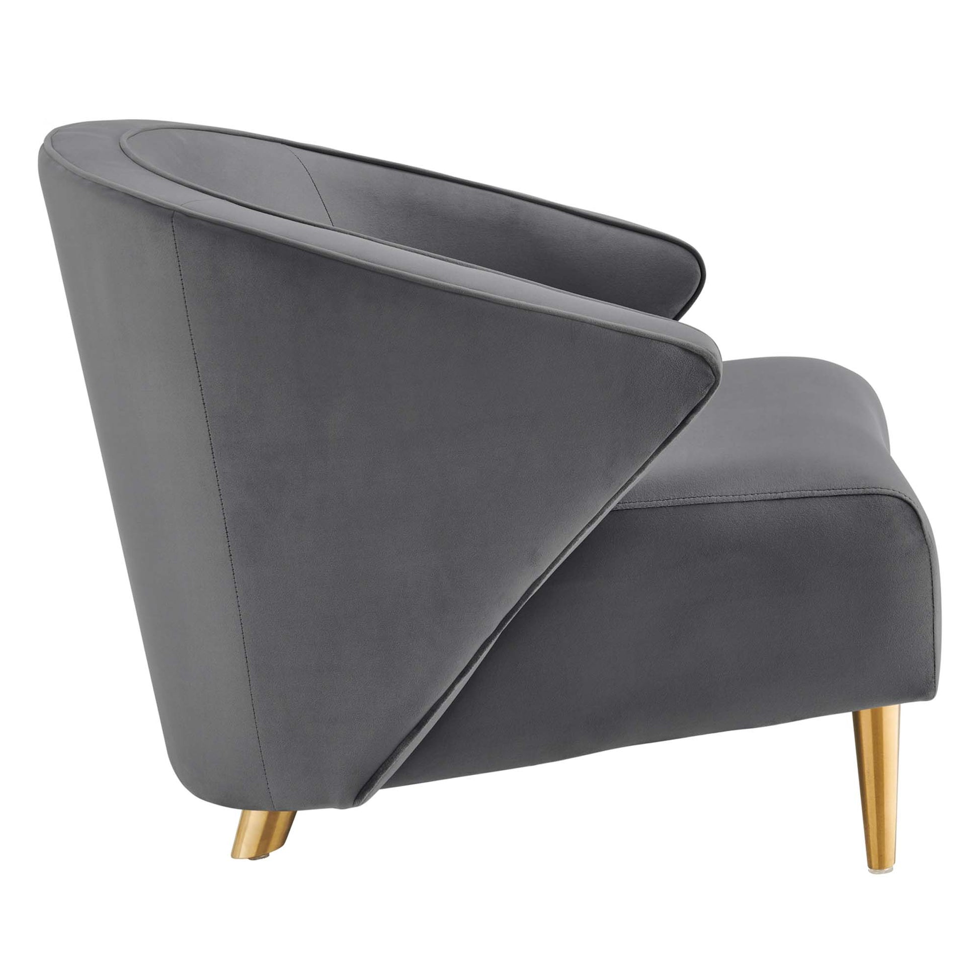 Grey velvet lounge chair with curved wraparound back and gold legs.