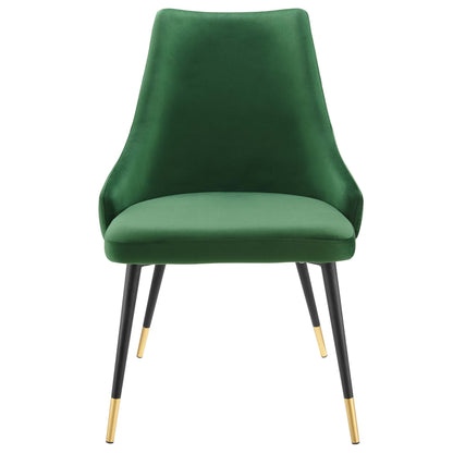 Emerald green velvet dining chair with curved high back, cushioned seat and black metal legs with gold tip caps.